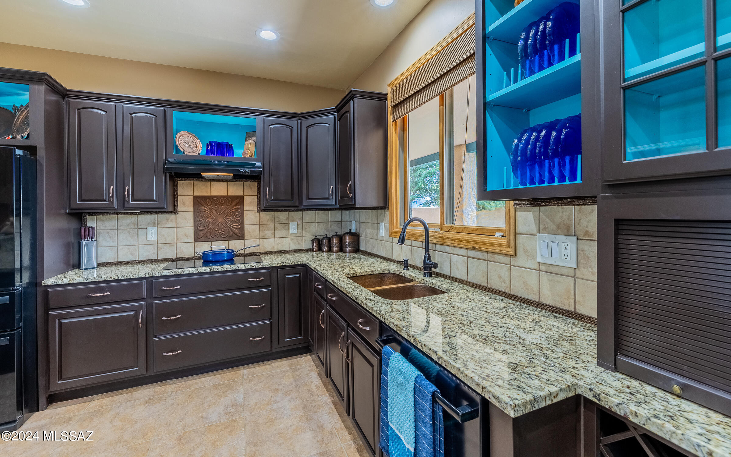 341 Sharon Road Vail, AZ 85641 - Photo 9 of 50 a kitchen with stainless steel appliances granite countertop a stove a sink and a microwave
