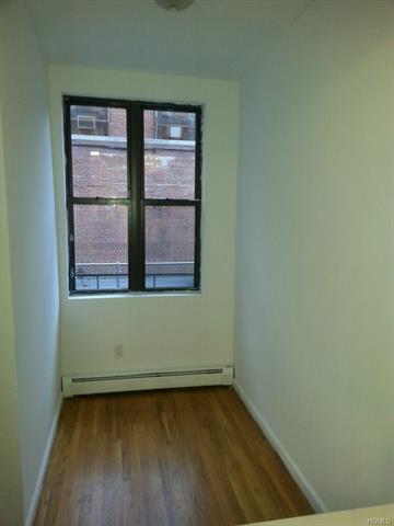 97 Elm Street, Unit 1E Yonkers, NY 10701 - Photo 1 of 1 a view of a room that has a window