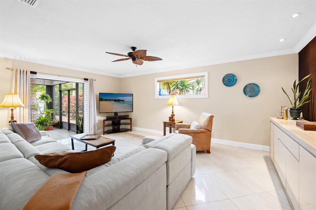 4700 Grant Street Hollywood, FL 33021 - Photo 11 of 32 a living room with furniture and a flat screen tv