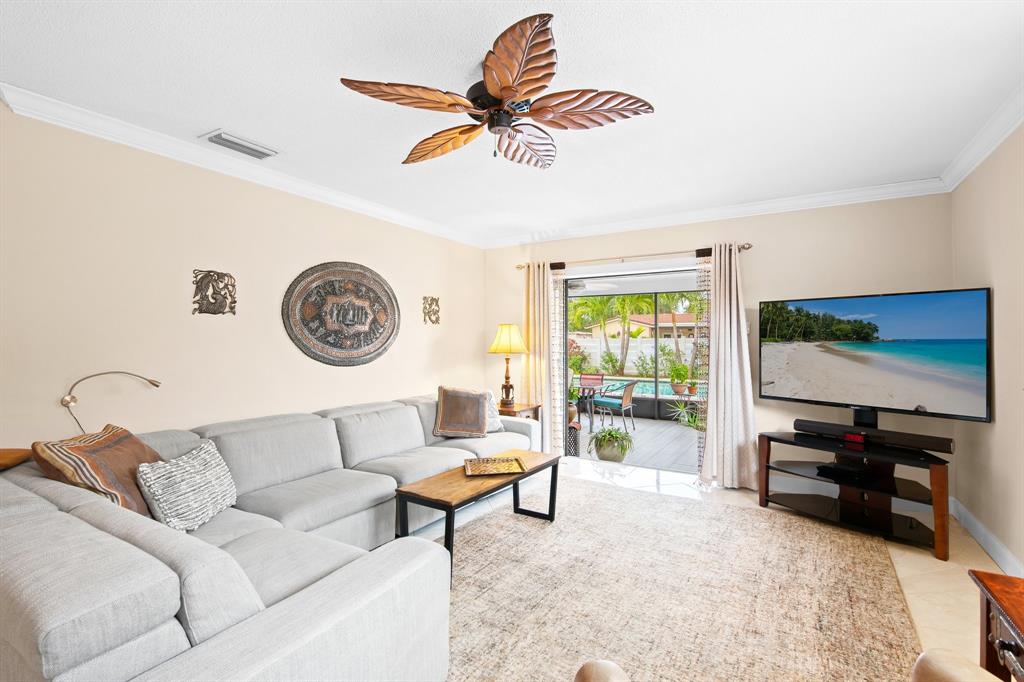 4700 Grant Street Hollywood, FL 33021 - Photo 12 of 32 a living room with furniture and a flat screen tv