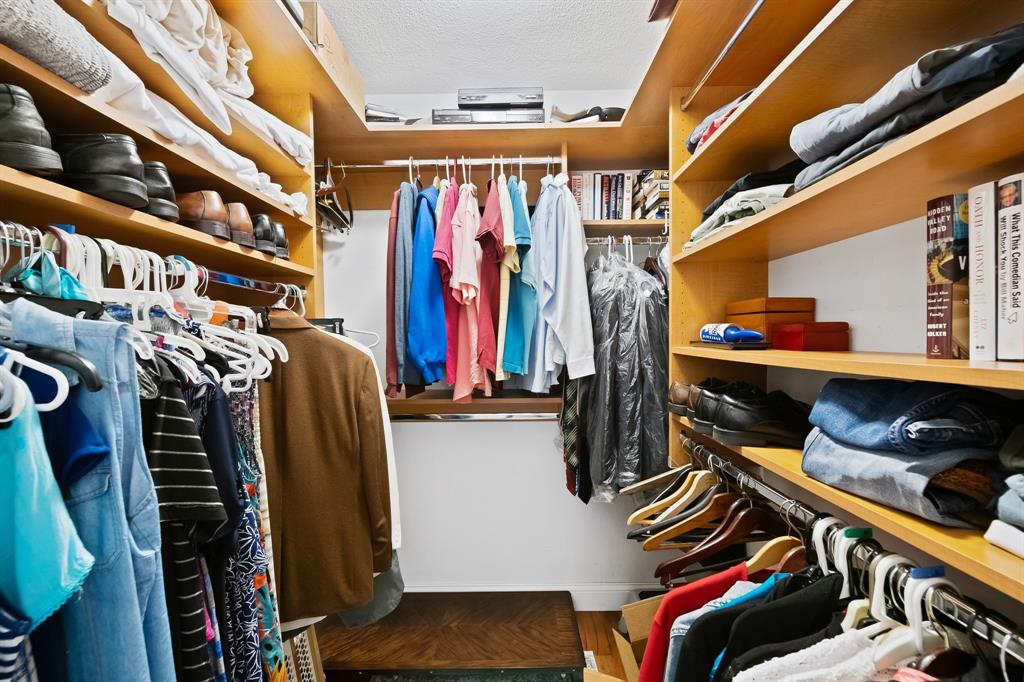 4700 Grant Street Hollywood, FL 33021 - Photo 17 of 32 a view of walk in closet with clothes and shoes