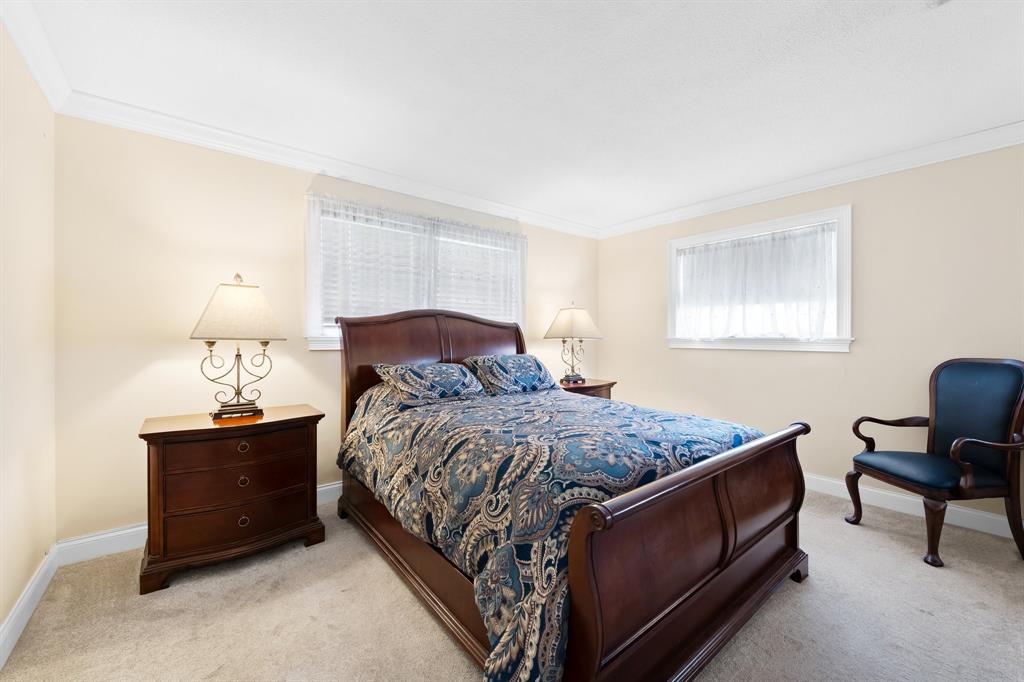 4700 Grant Street Hollywood, FL 33021 - Photo 20 of 32 a bedroom with a bed and chair