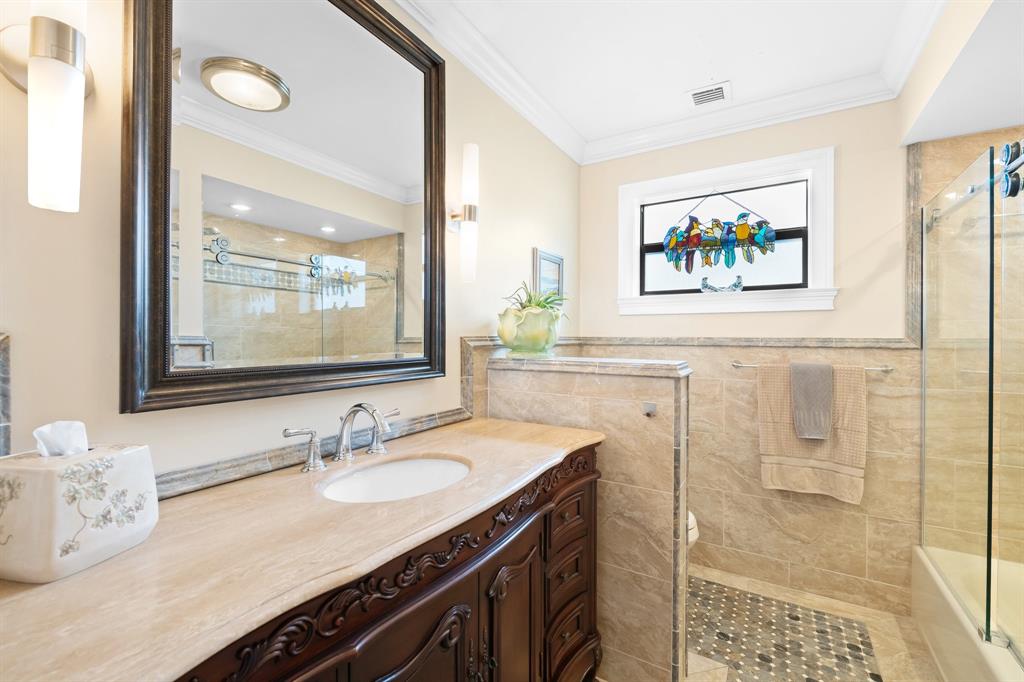 4700 Grant Street Hollywood, FL 33021 - Photo 21 of 32 a bathroom with a sink vanity and a mirror