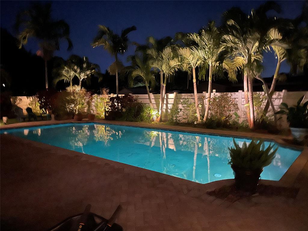 4700 Grant Street Hollywood, FL 33021 - Photo 29 of 32 a view of a swimming pool with a patio