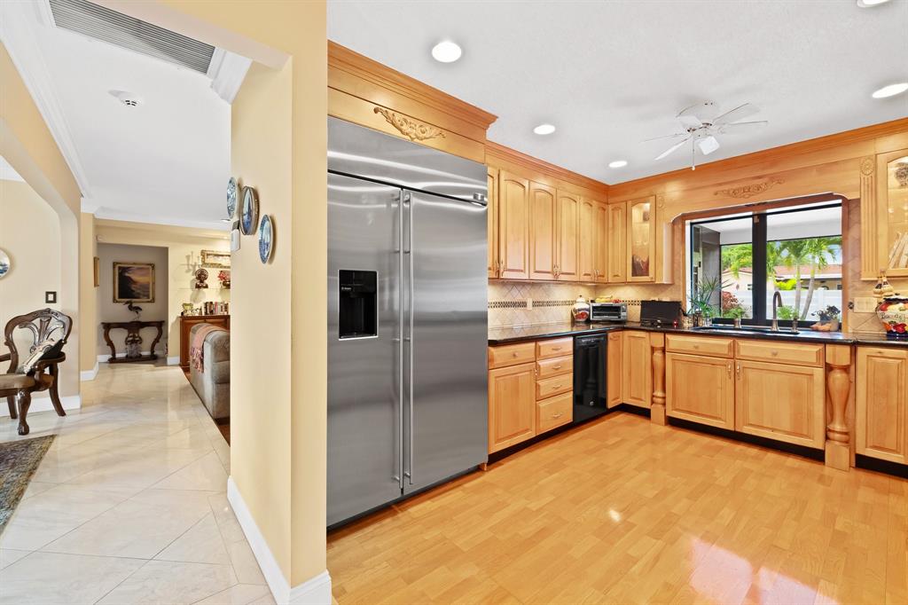 4700 Grant Street Hollywood, FL 33021 - Photo 6 of 32 a kitchen with stainless steel appliances a refrigerator and a stove top oven