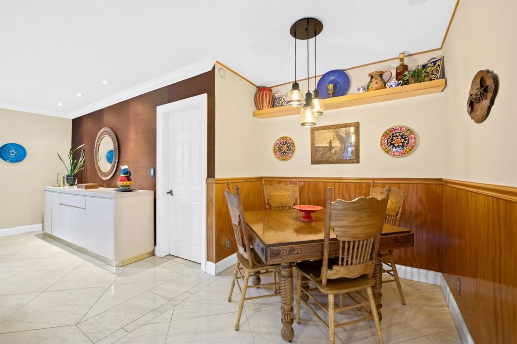 4700 Grant Street Hollywood, FL 33021 - Photo 9 of 32 a view of a dining area with furniture and chandelier