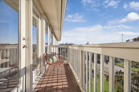 a view of a patio with a table and chair