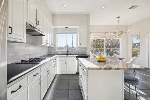 a view of a balcony with wooden floor