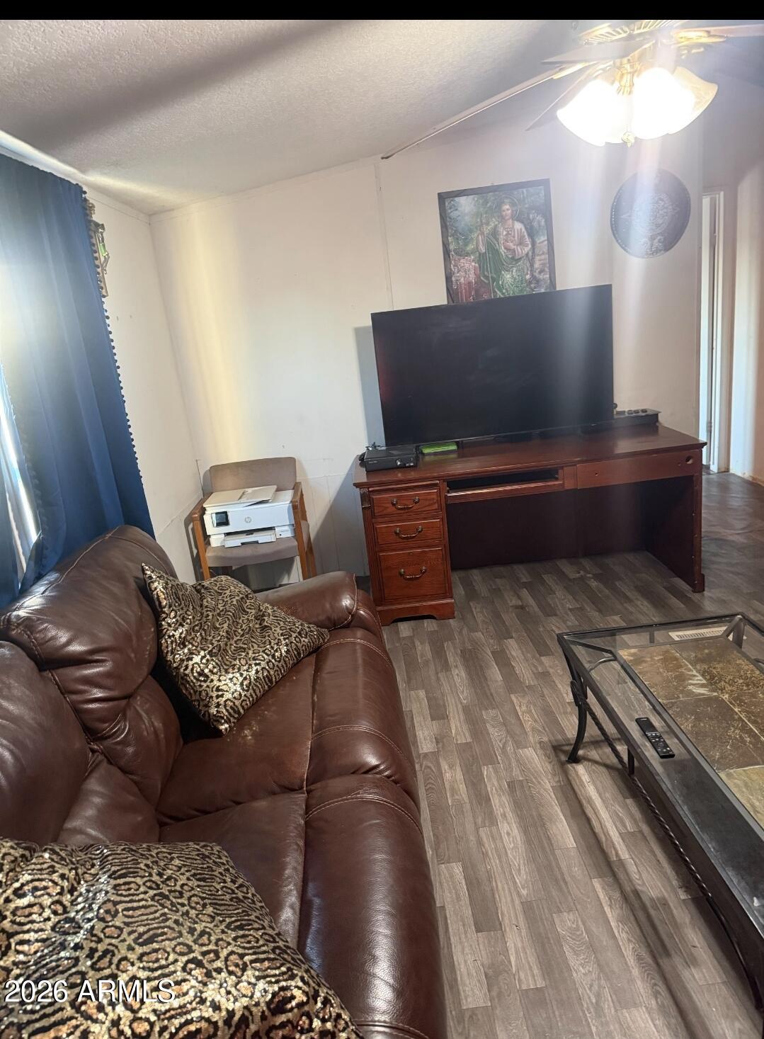 2625 Saddle Vista Road Tonopah, AZ 85354 - Photo 4 of 19 a living room with furniture and a flat screen tv