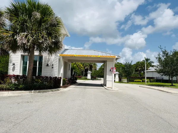 a view of a house with backyard and porch