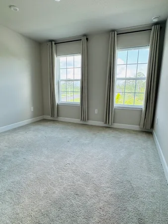 an empty room that has a bathroom