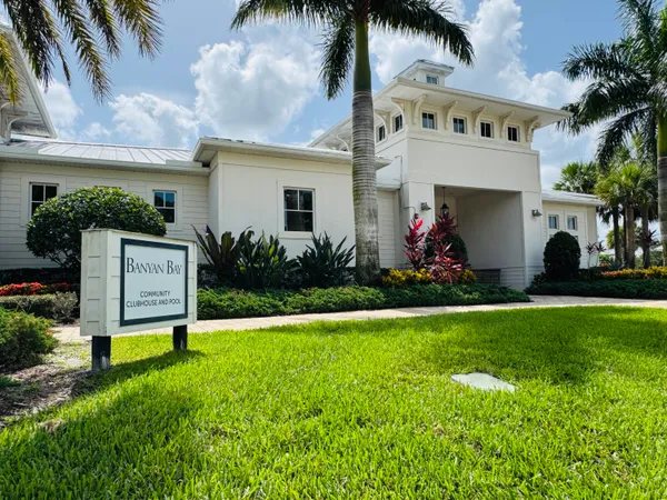 a front view of a house with a garden and yard