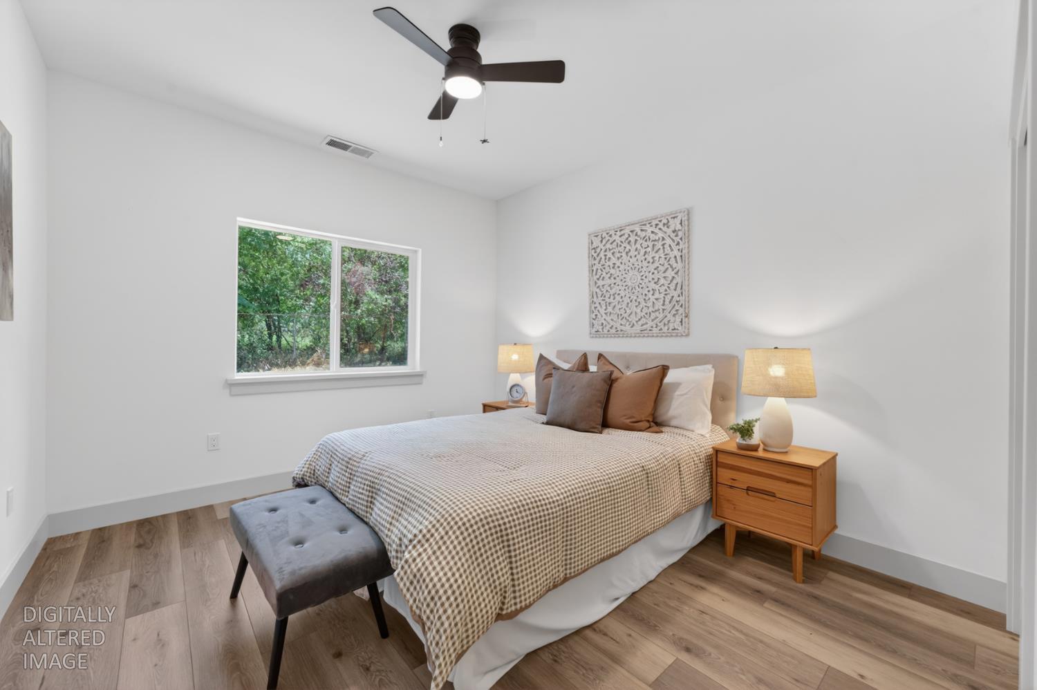 280 Jan Road Grass Valley, CA 95945 - Photo 29 of 66 a bedroom with a bed wooden floor and window