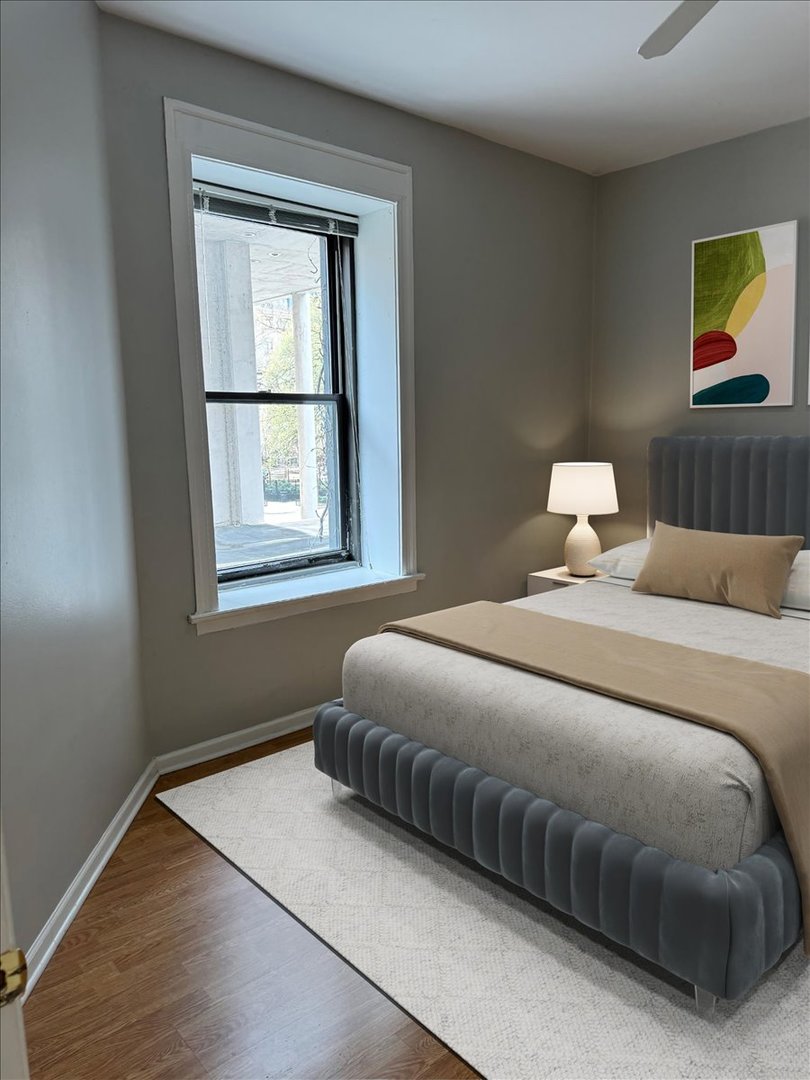 20 East Goethe Street, Unit 203 Chicago, IL 60610 - Photo 6 of 9 a bedroom with a bed and window