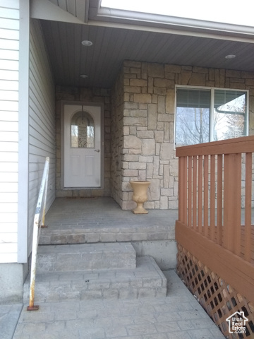 11473 South Dempsey Creek Road Lava Hot Springs, ID 83246 - Photo 47 of 47 View of exterior entry with a porch and stone siding