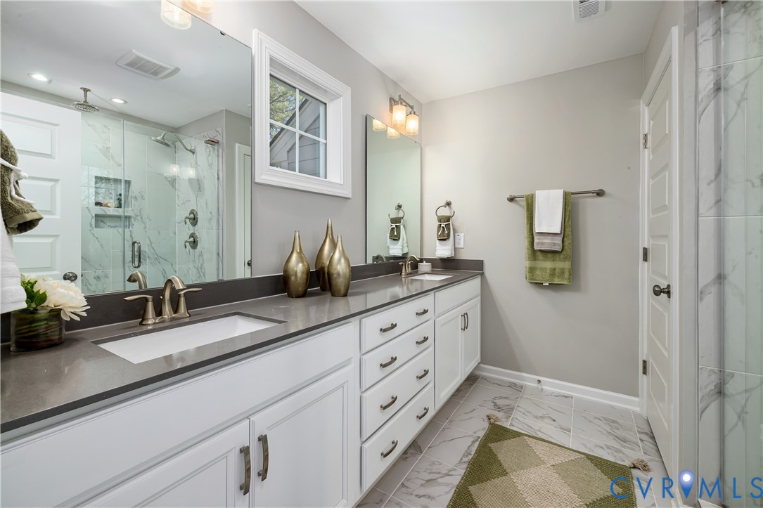 17348 Alana Drive Moseley, VA 23120 - Photo 20 of 36 a spacious bathroom with double sink and a mirror