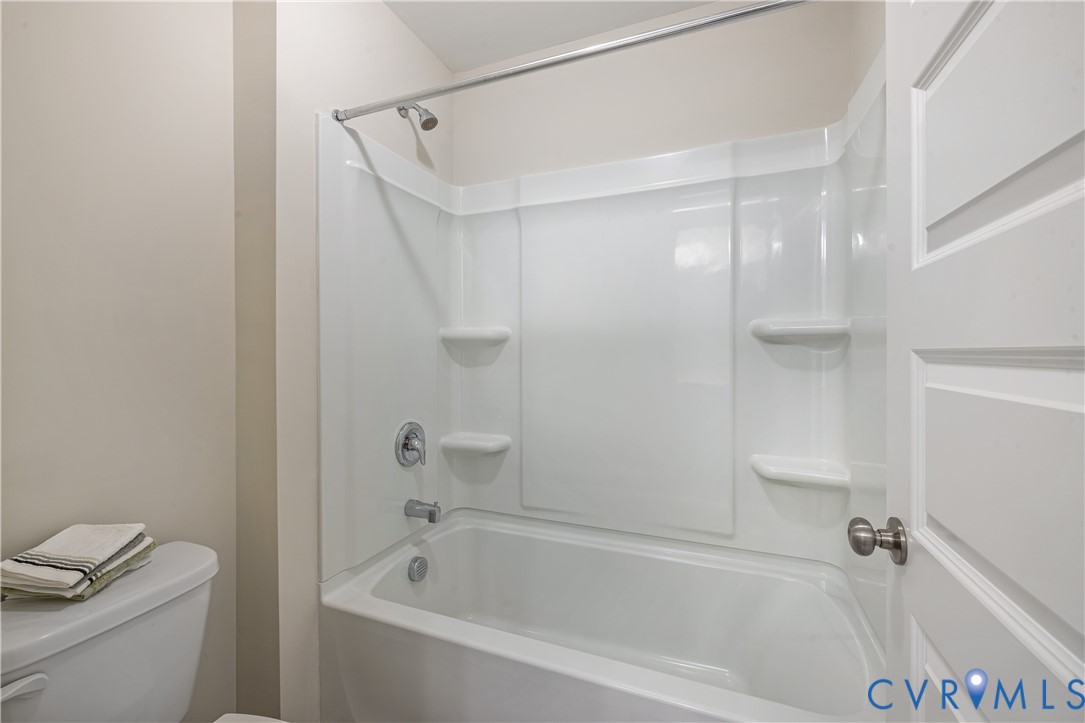 17348 Alana Drive Moseley, VA 23120 - Photo 24 of 36 a white bath tub sitting next to a white toilet and vanity