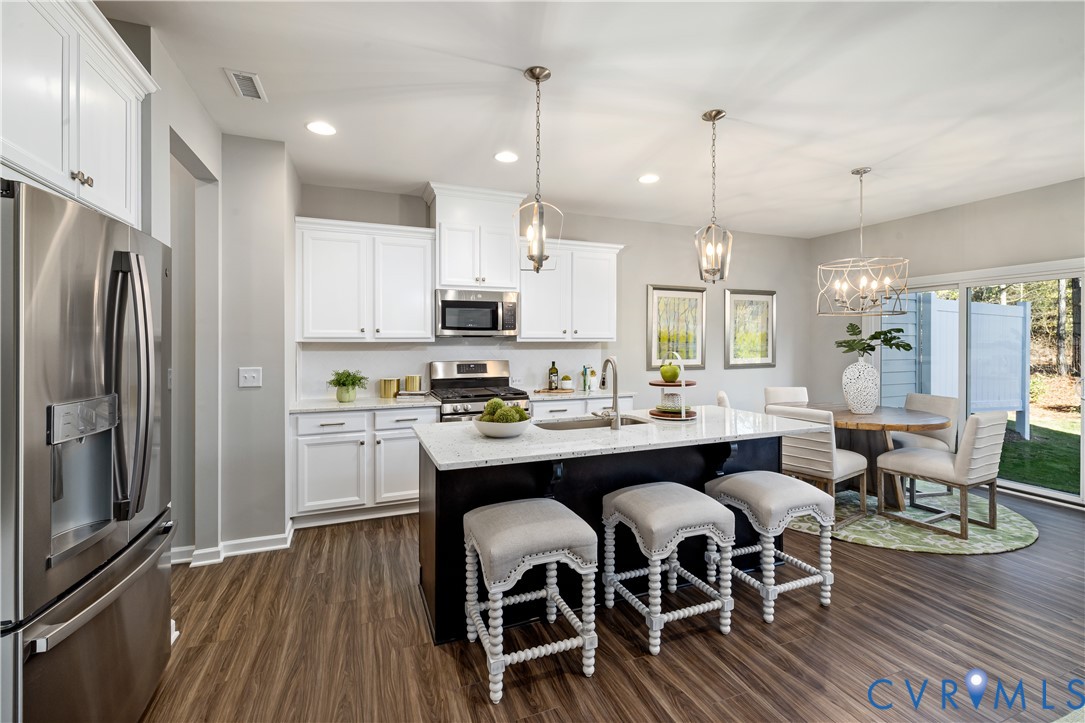 17348 Alana Drive Moseley, VA 23120 - Photo 4 of 36 a large kitchen with a table and chairs