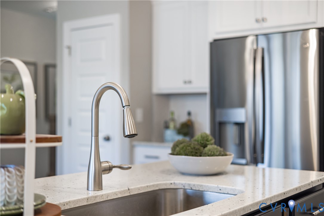 17348 Alana Drive Moseley, VA 23120 - Photo 10 of 36 a view of a kitchen with a sink and potted plant
