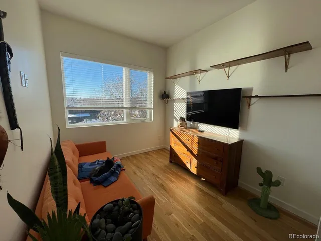 a room with furniture and flat screen tv