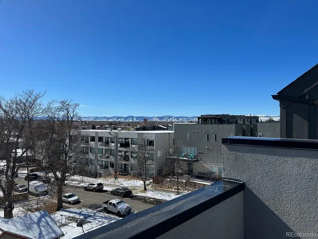 a view of a balcony with city view