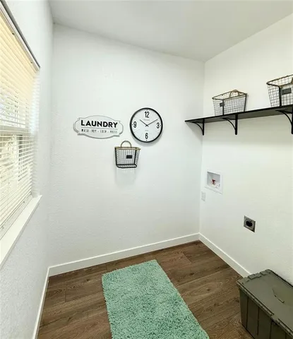 a view of a room with rack and wooden floor