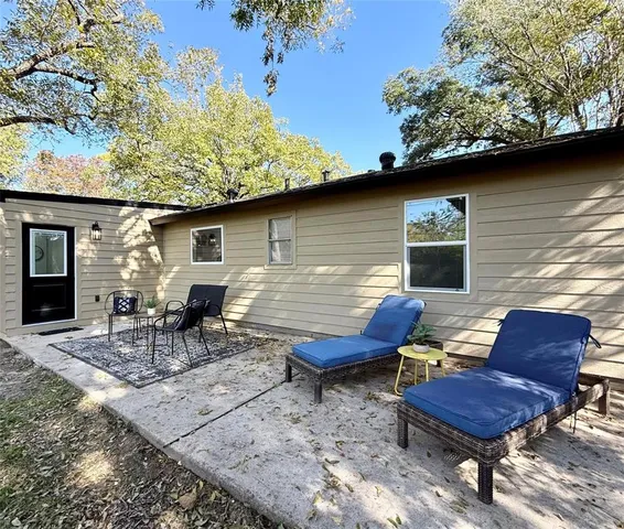 a view of a chairs and table in the patio