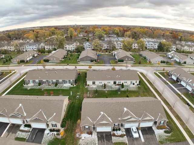 an aerial view of house with yard