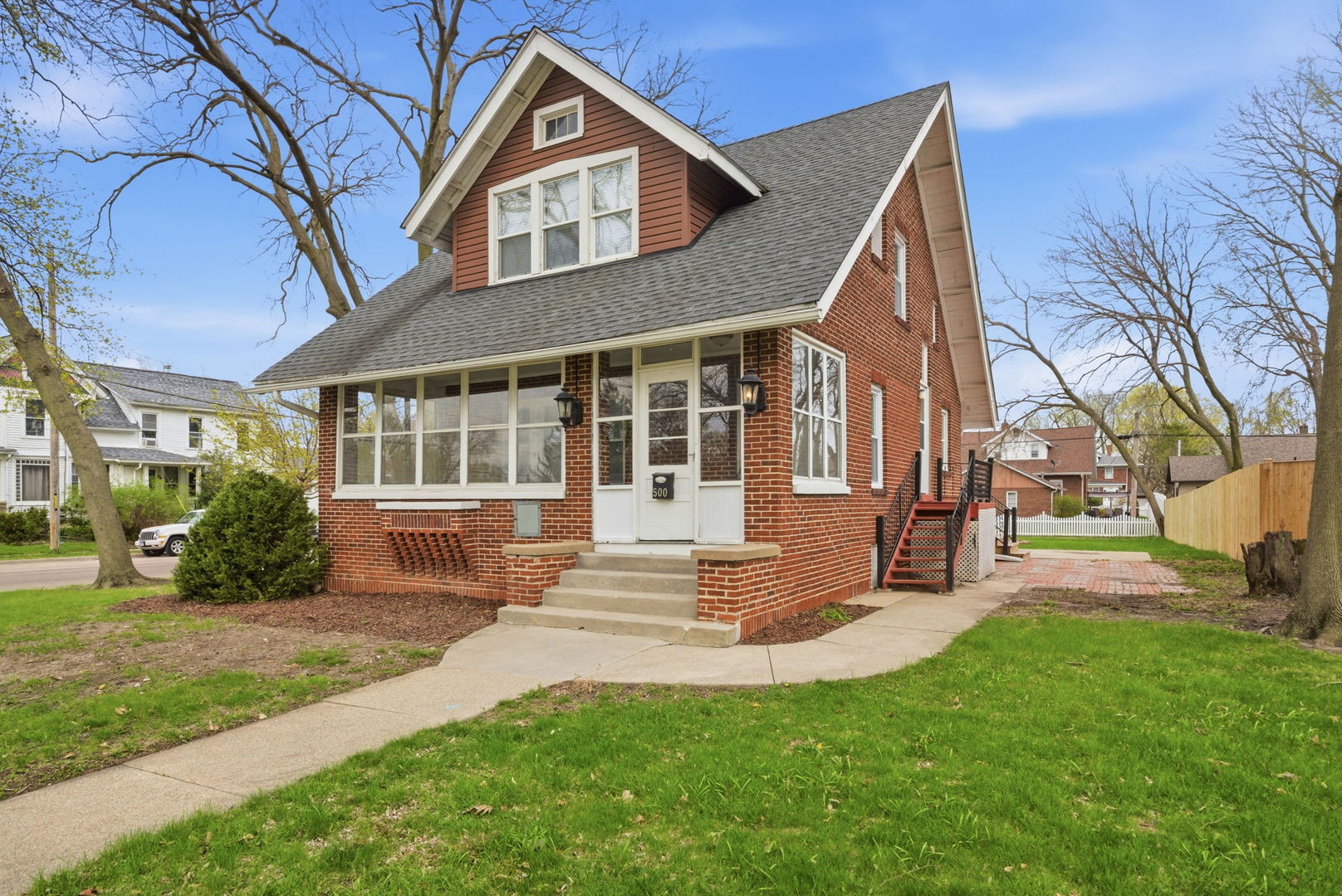 500 Catherine Street Ottawa, IL 61350 - Photo 1 of 23 a front view of a house with a yard table and chairs