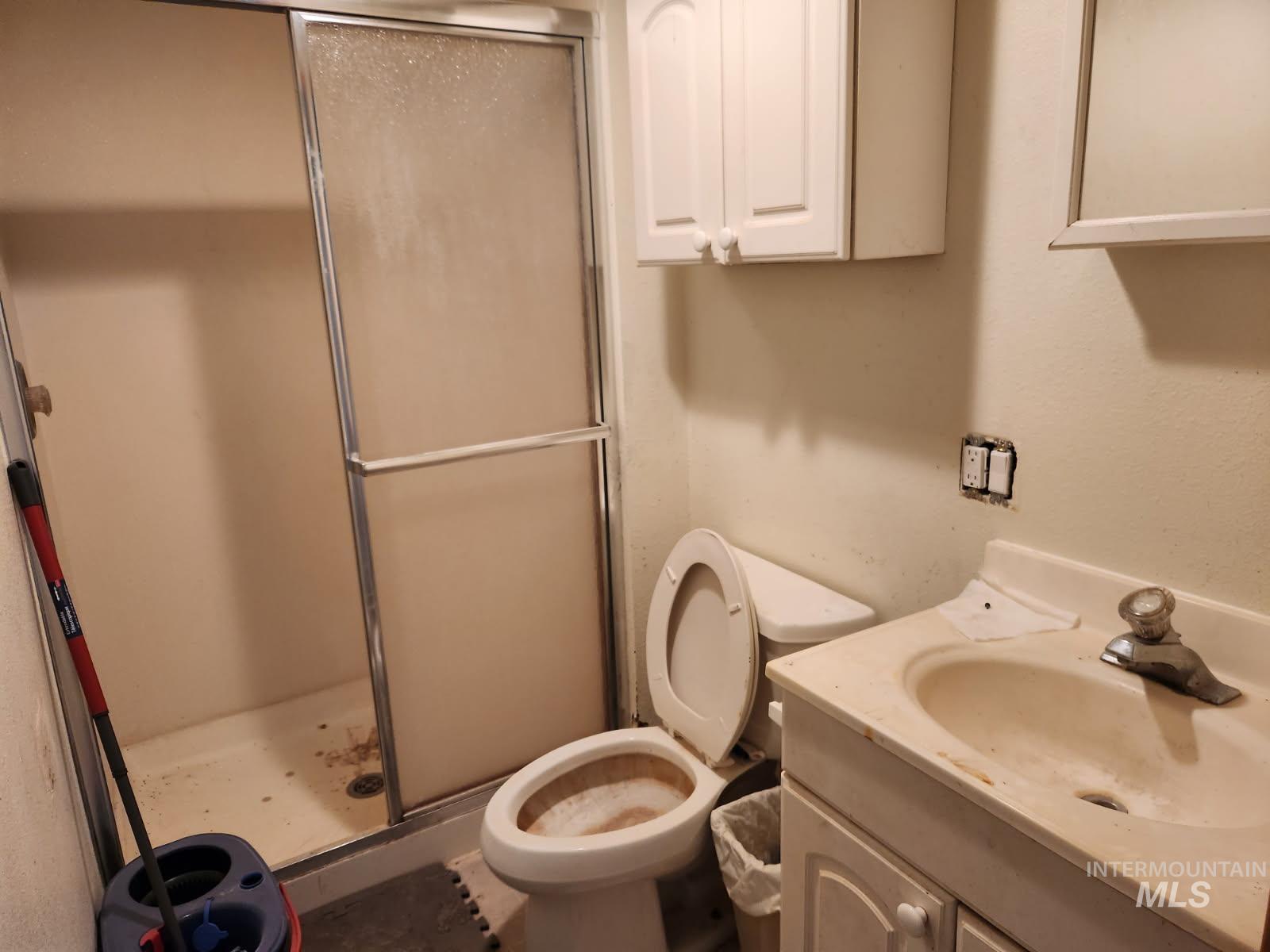 525 North 4th Street Nyssa, OR 97913 - Photo 14 of 17 Bathroom with a shower stall and vanity