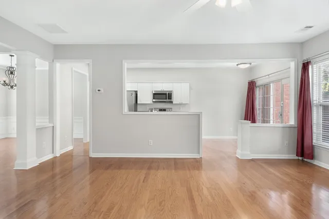 a view of a kitchen with a sink cabinet and a window