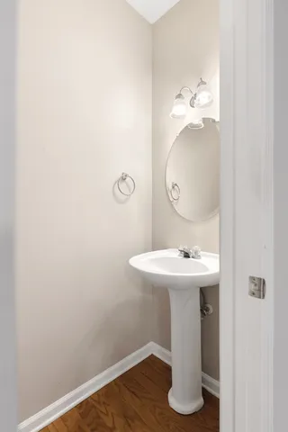 a bathroom with a sink and mirror