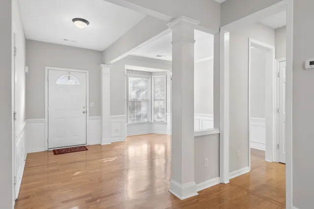 a view of entryway with wooden floor