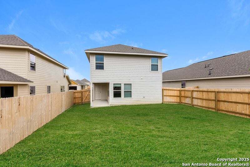 9318 Evening Shade Court San Antonio, TX 78211 - Photo 3 of 15 a front view of a house with a yard