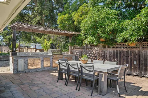 a patio with table and chairs