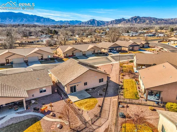 an aerial view of residential houses with outdoor space