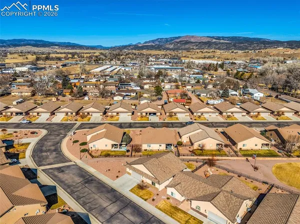 an aerial view of residential houses with outdoor space