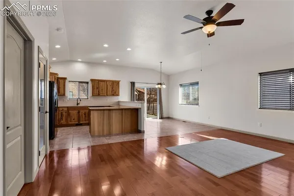 a view of kitchen with cabinets and wooden floor