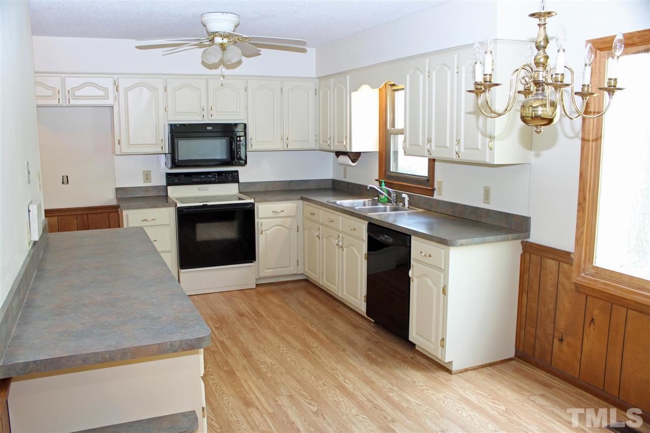 3300 Manor Ridge Drive Raleigh, NC 27603 - Photo 8 of 25 Spacious and bright country kitchen with tons of cabinets and counter space.
