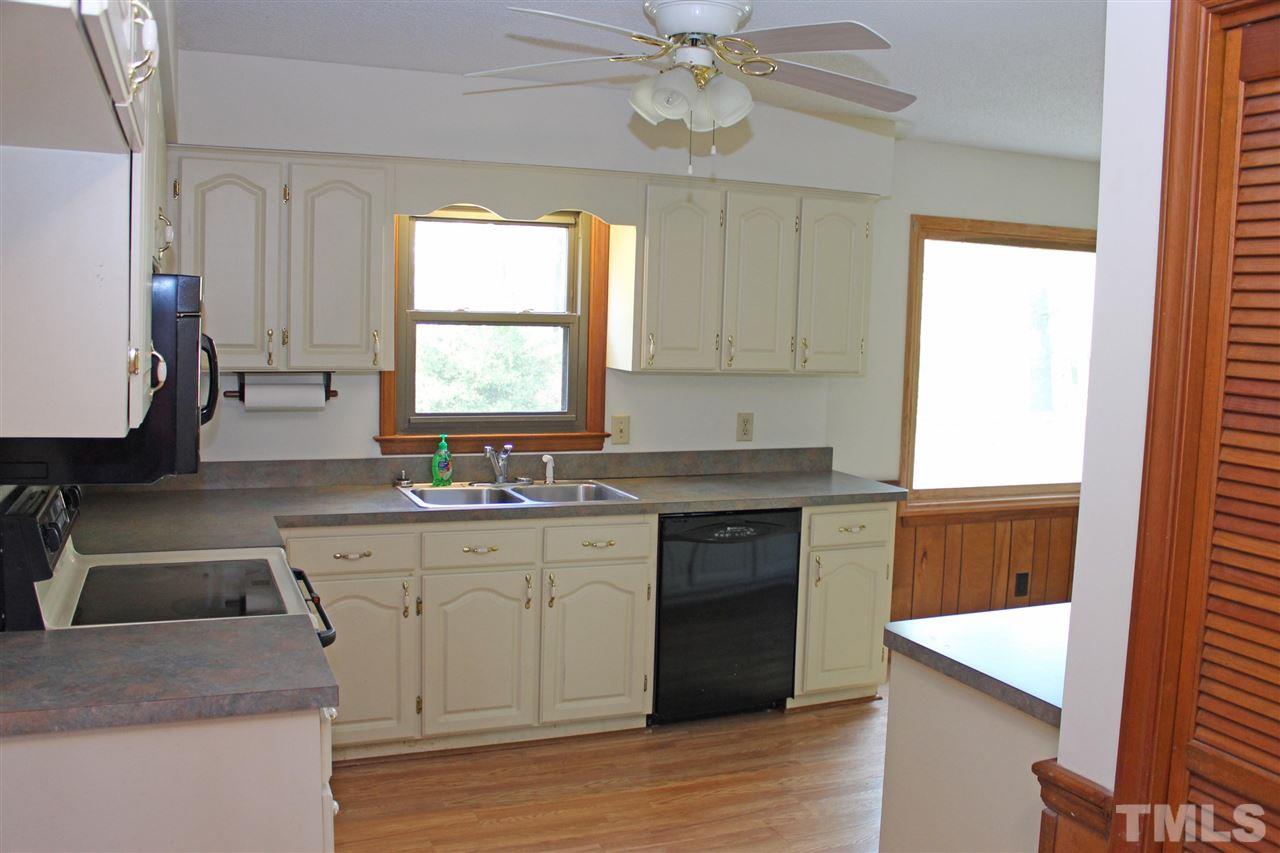 3300 Manor Ridge Drive Raleigh, NC 27603 - Photo 9 of 25 Kitchen open to spacious breakfast room with picture window.
