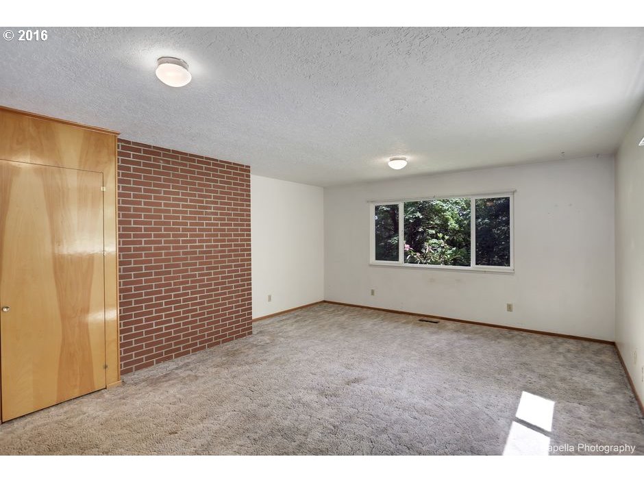 19428 Northwest Logie Trail Road Portland, OR 97231 - Photo 11 of 20 a view of an empty room with a window