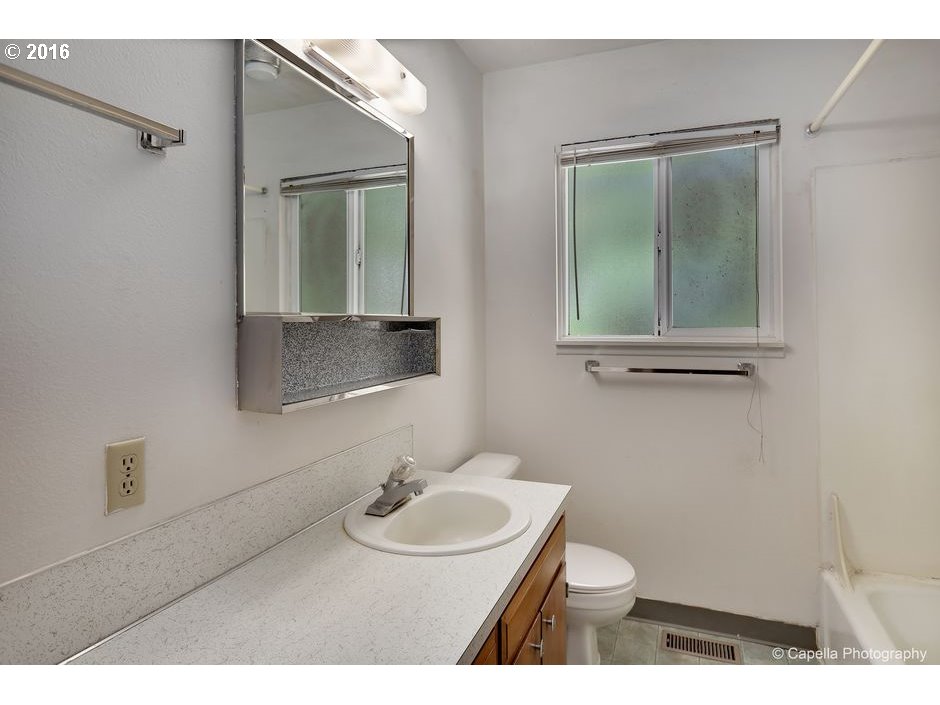 19428 Northwest Logie Trail Road Portland, OR 97231 - Photo 13 of 20 a bathroom with a sink and a mirror