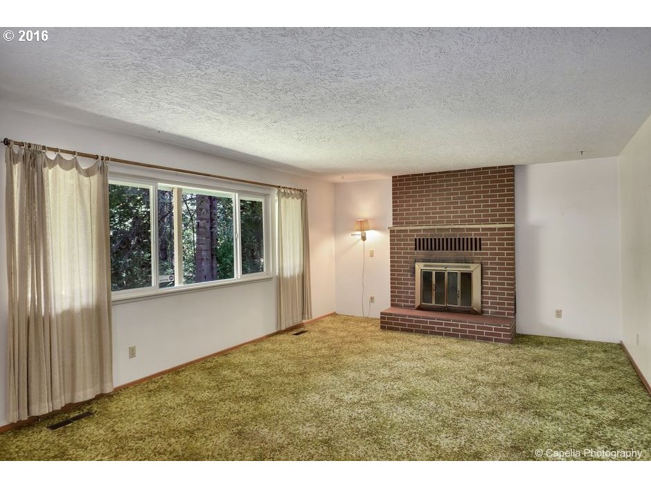 19428 Northwest Logie Trail Road Portland, OR 97231 - Photo 4 of 20 a view of empty room with window