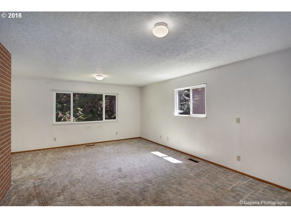 19428 Northwest Logie Trail Road Portland, OR 97231 - Photo 10 of 20 a view of an empty room with a window