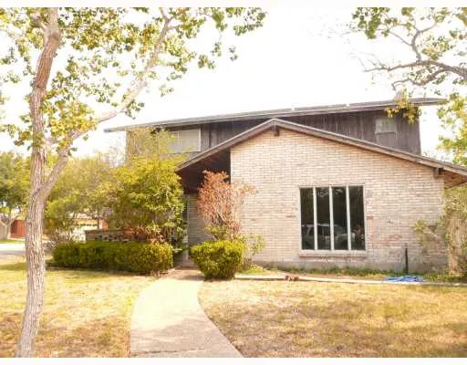 a view of house with yard