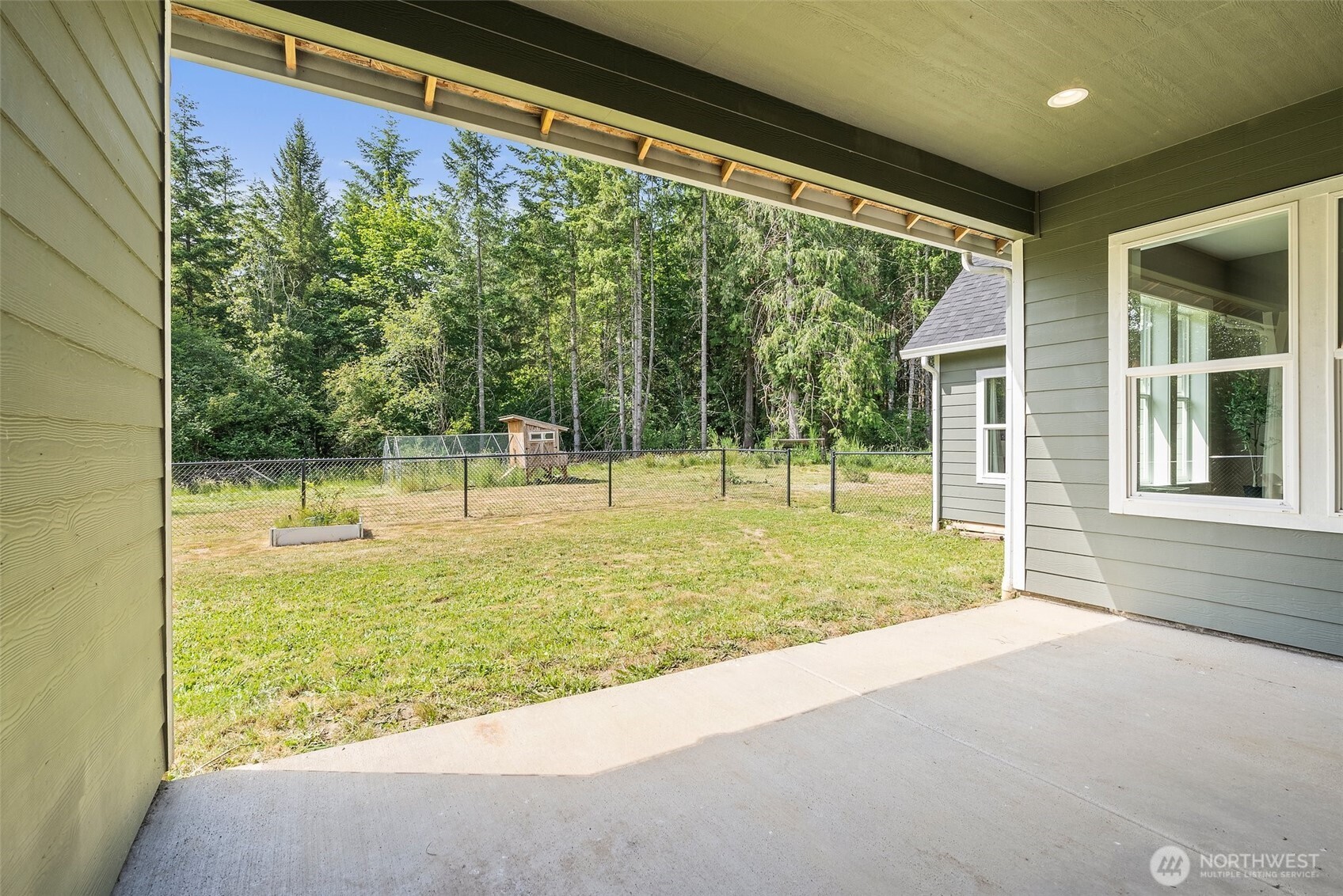 809 Southwest Gertrude Avenue Winlock, WA 98596 - Photo 33 of 40 a view of a house with a backyard and a swimming pool