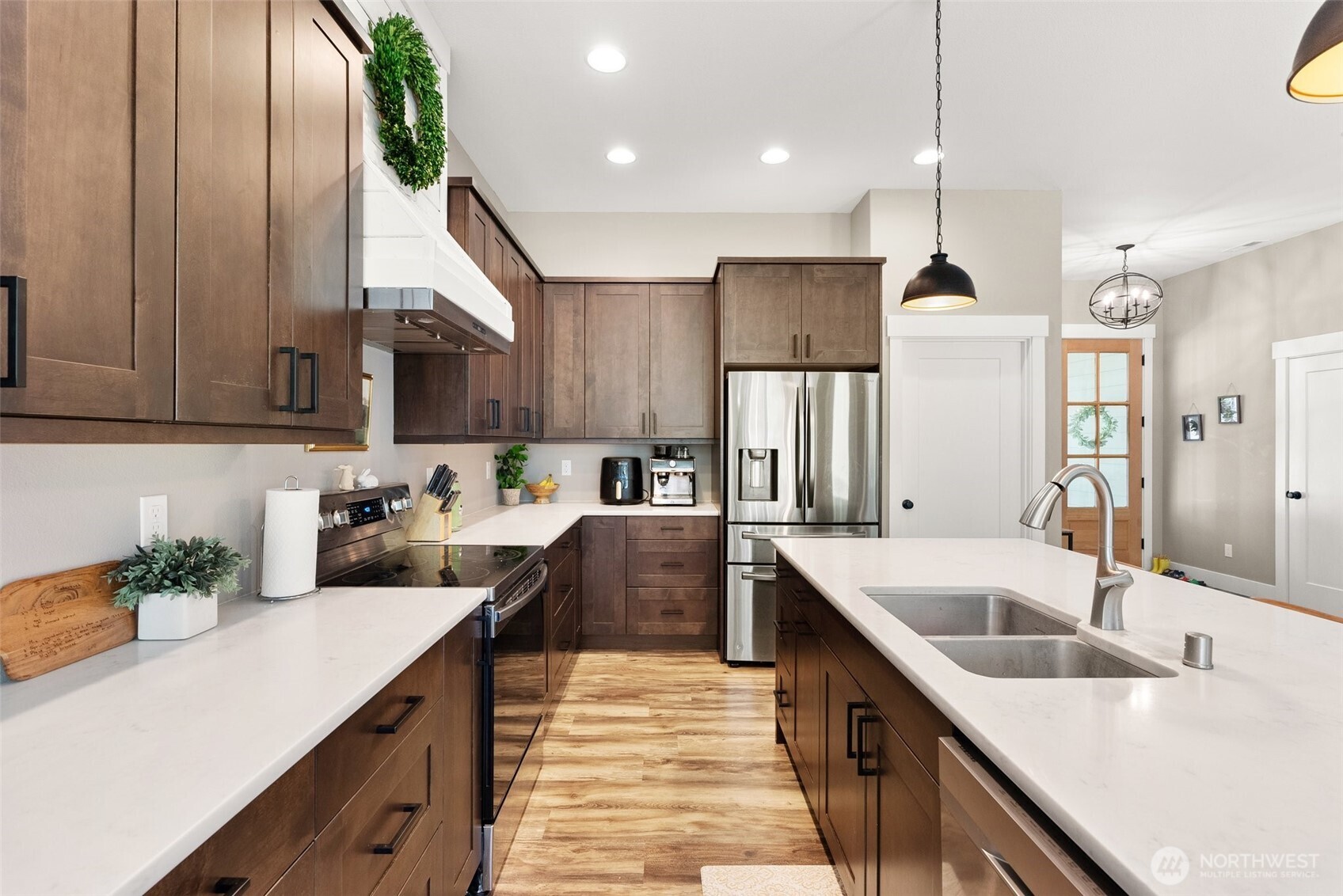 809 Southwest Gertrude Avenue Winlock, WA 98596 - Photo 9 of 40 a kitchen with stainless steel appliances granite countertop a sink a stove and a refrigerator