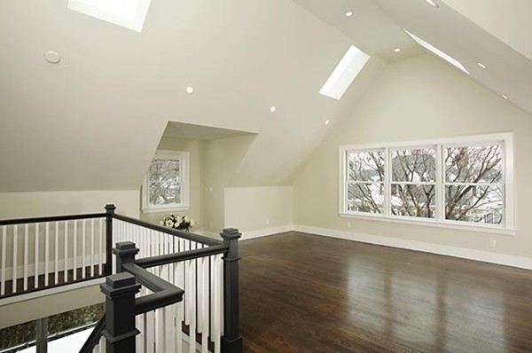 69 Coolidge Street Brookline, MA 02446 - Photo 9 of 9 a view of an entryway with wooden floor