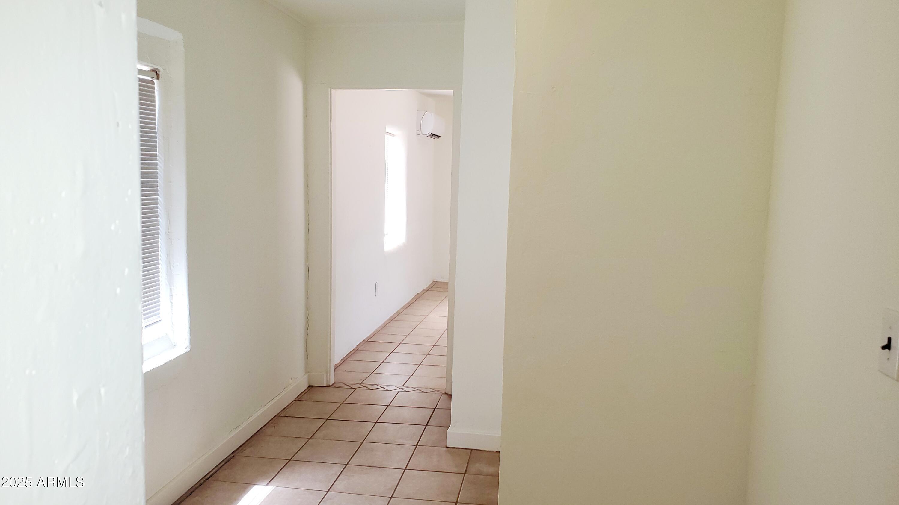 1005 West Purdy Lane Bisbee, AZ 85603 - Photo 12 of 23 a view of a hallway with a white walls