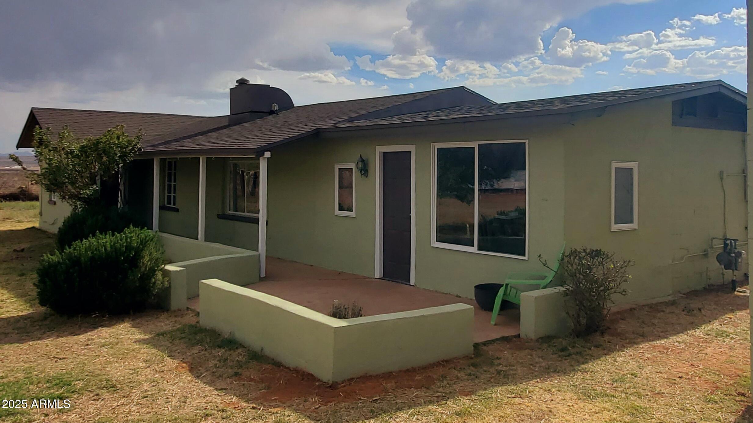 1005 West Purdy Lane Bisbee, AZ 85603 - Photo 2 of 23 a front view of a house with garden